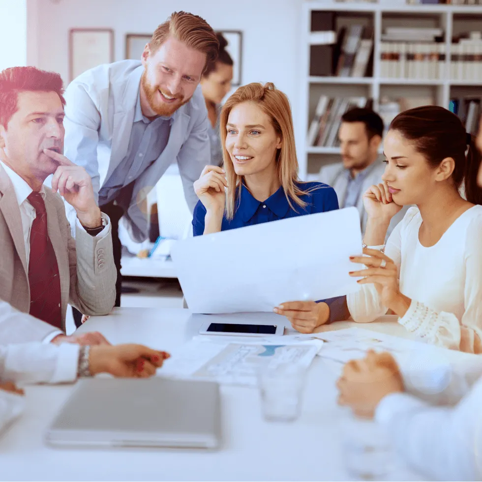 Employees Chatting And Discussing In Office